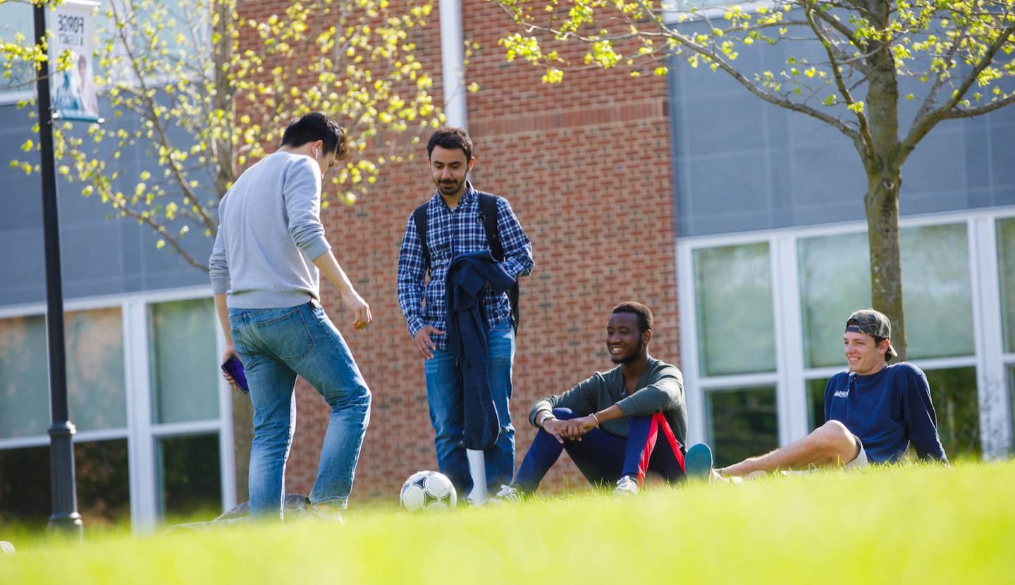 Students standing outside on campus